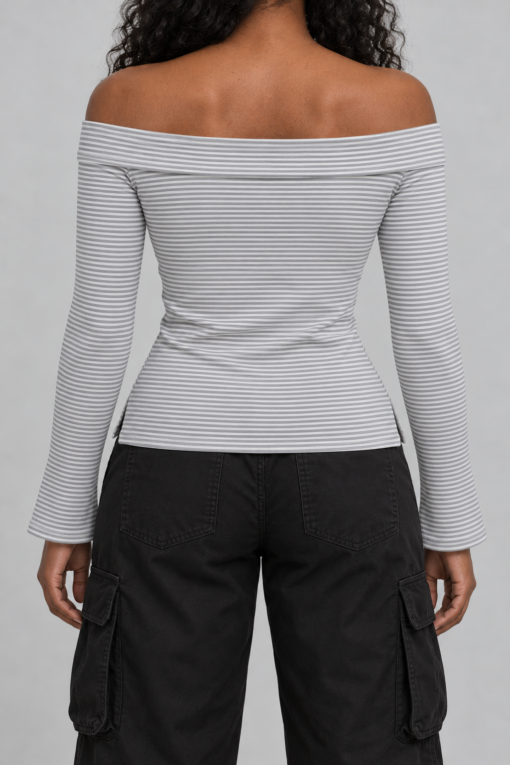 fitted off-shoulder long sleeve top in fine grey and white stripes with a tiny NOT YET 00 line on the chest, on model, back view