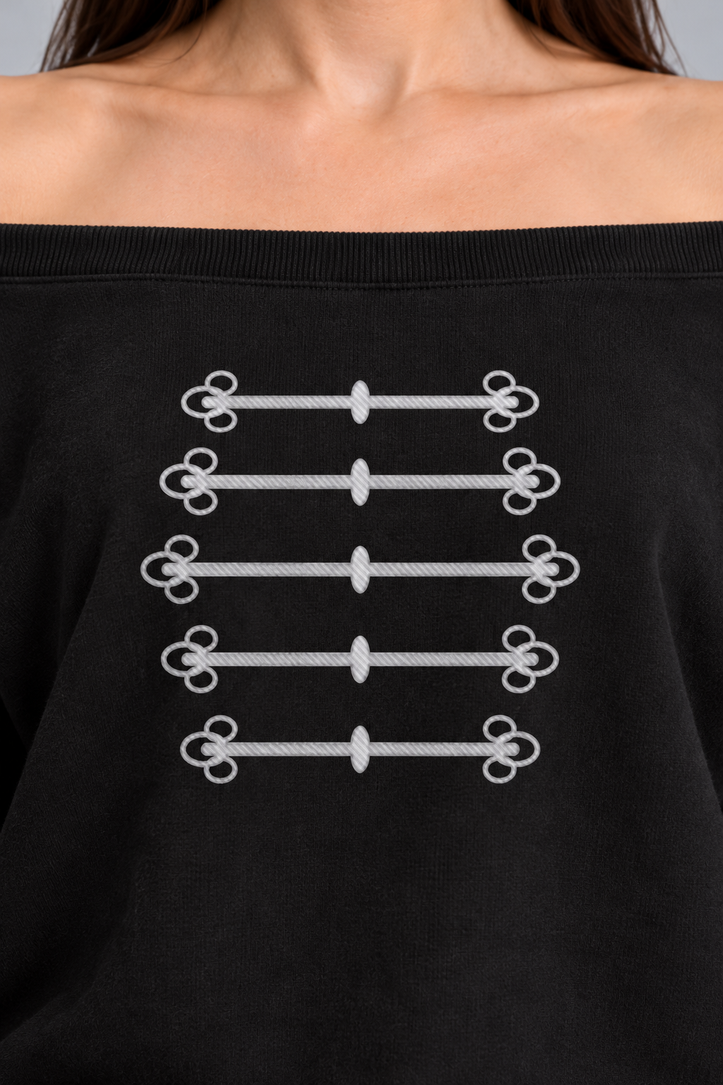 black off-shoulder sweatshirt with silver-grey military frogging across the chest, close-up of the silver-grey frogging across the chest