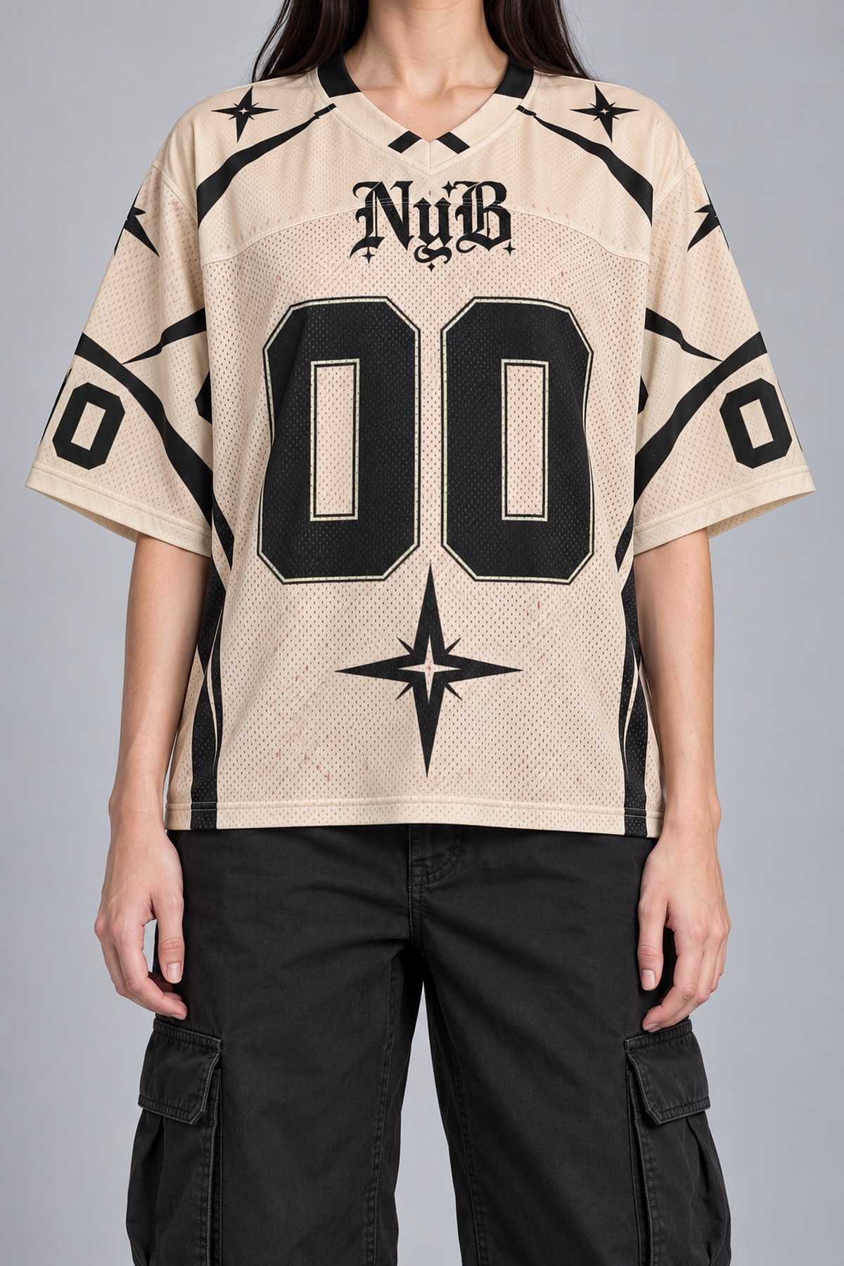 "NOUGHT" cream and black football jersey, worn, front view