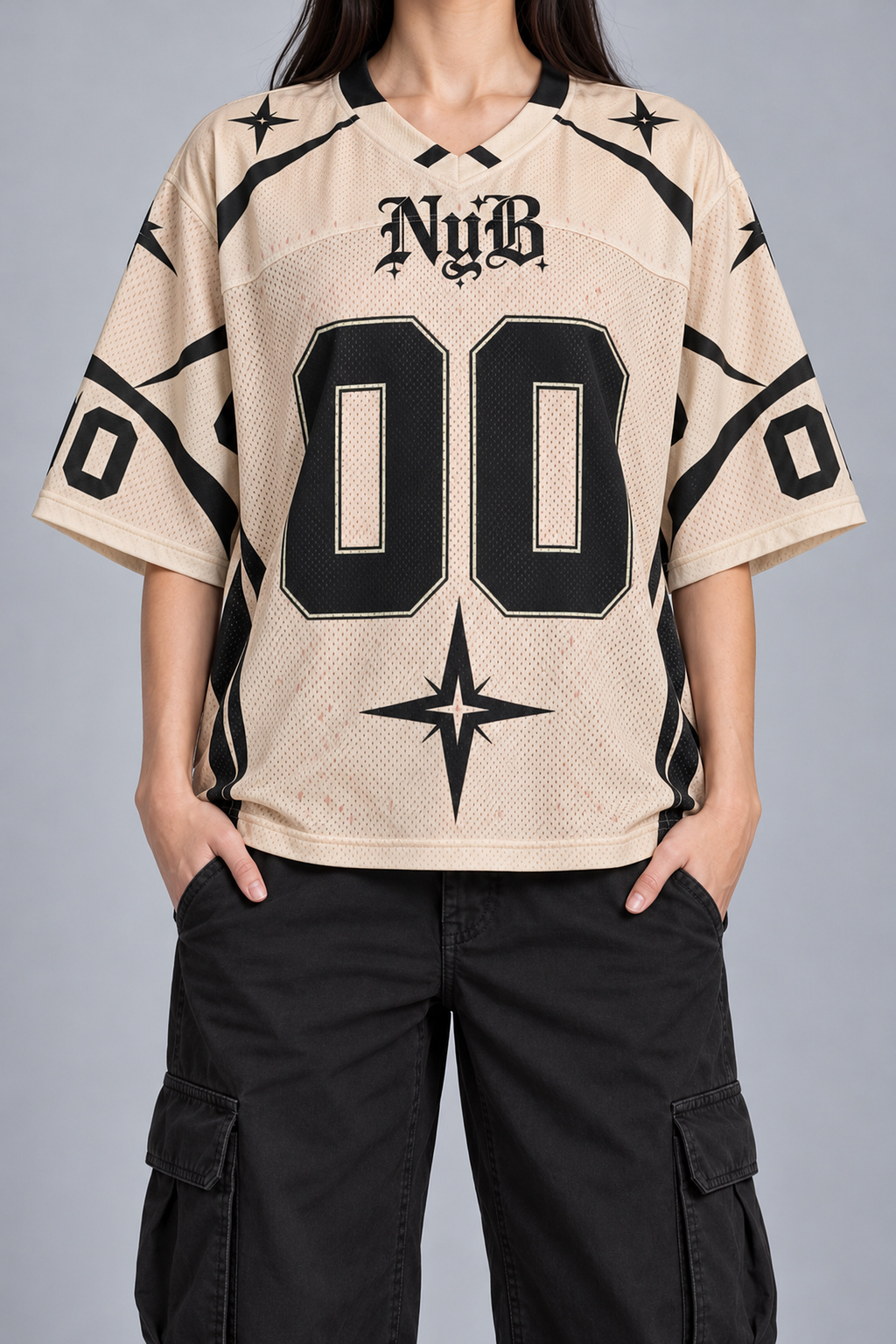 "NOUGHT" cream and black football jersey, worn, front view, hands in pockets